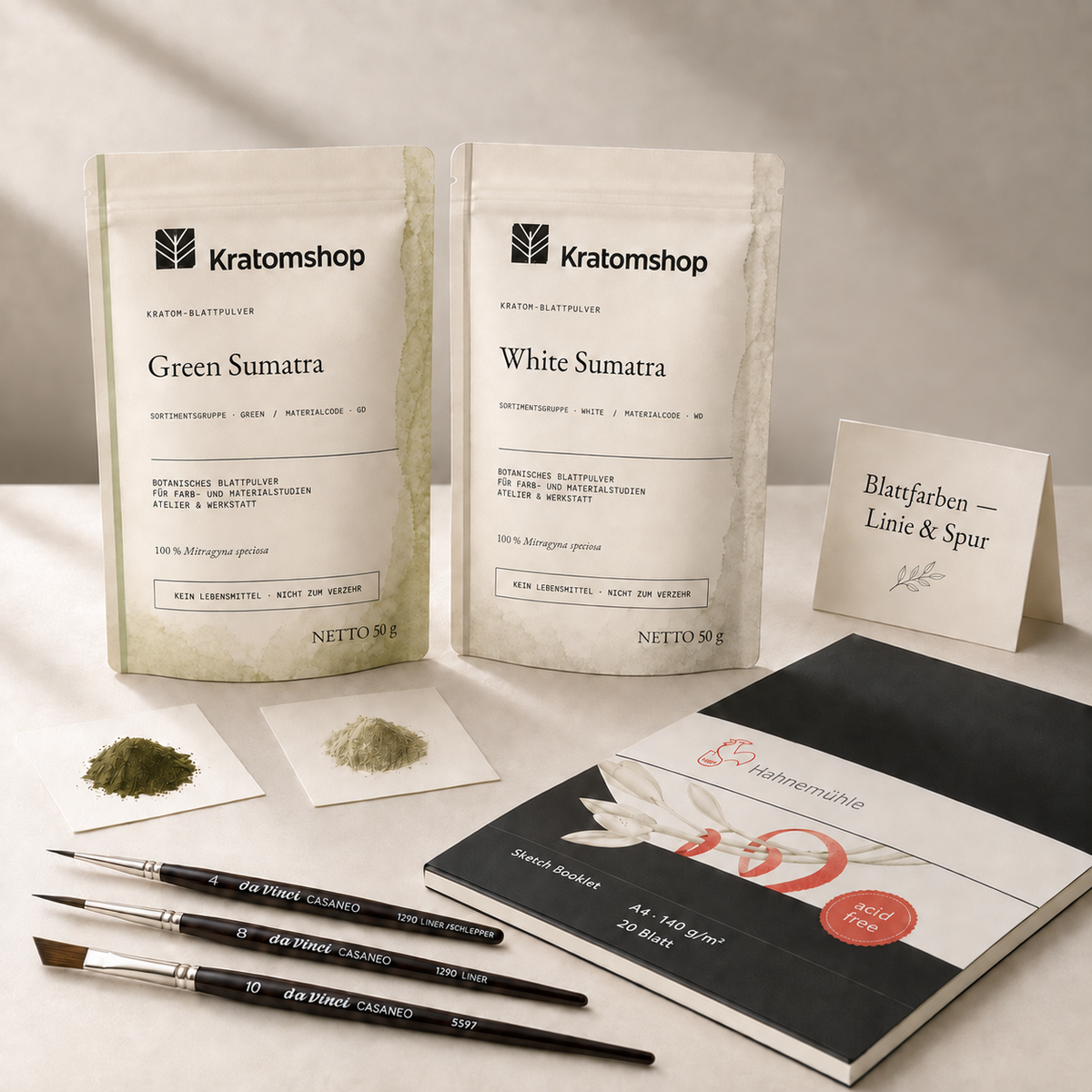 Leaf Colours — Line & Mark with Green Sumatra GD and White Sumatra WD kratom leaf powder, a Hahnemühle sketch booklet and three da Vinci brushes